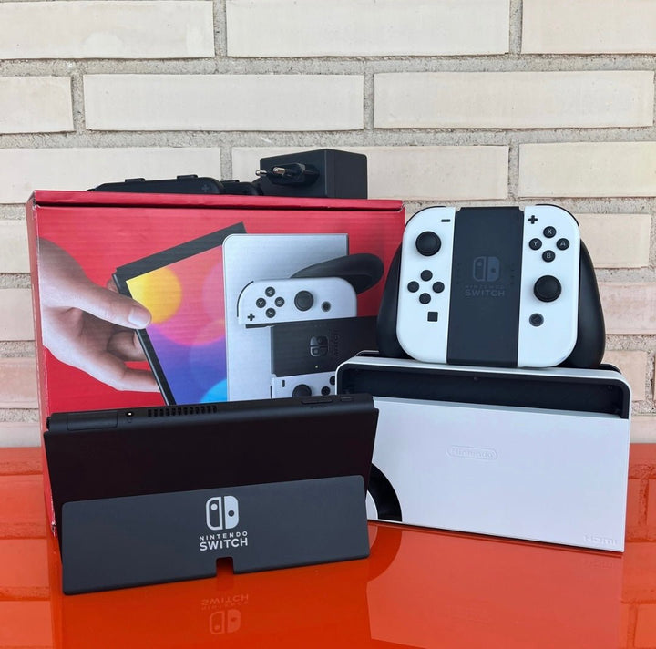 Nintendo Switch OLED blanca y negra - Videojuegoos